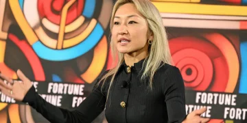 Sarah Guo speaking at a venture capital and AI conference